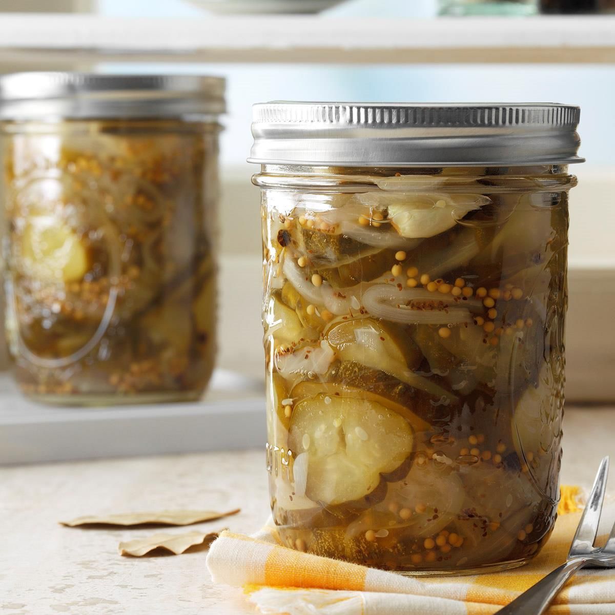 Best ever sweet pickles in two glass jars.