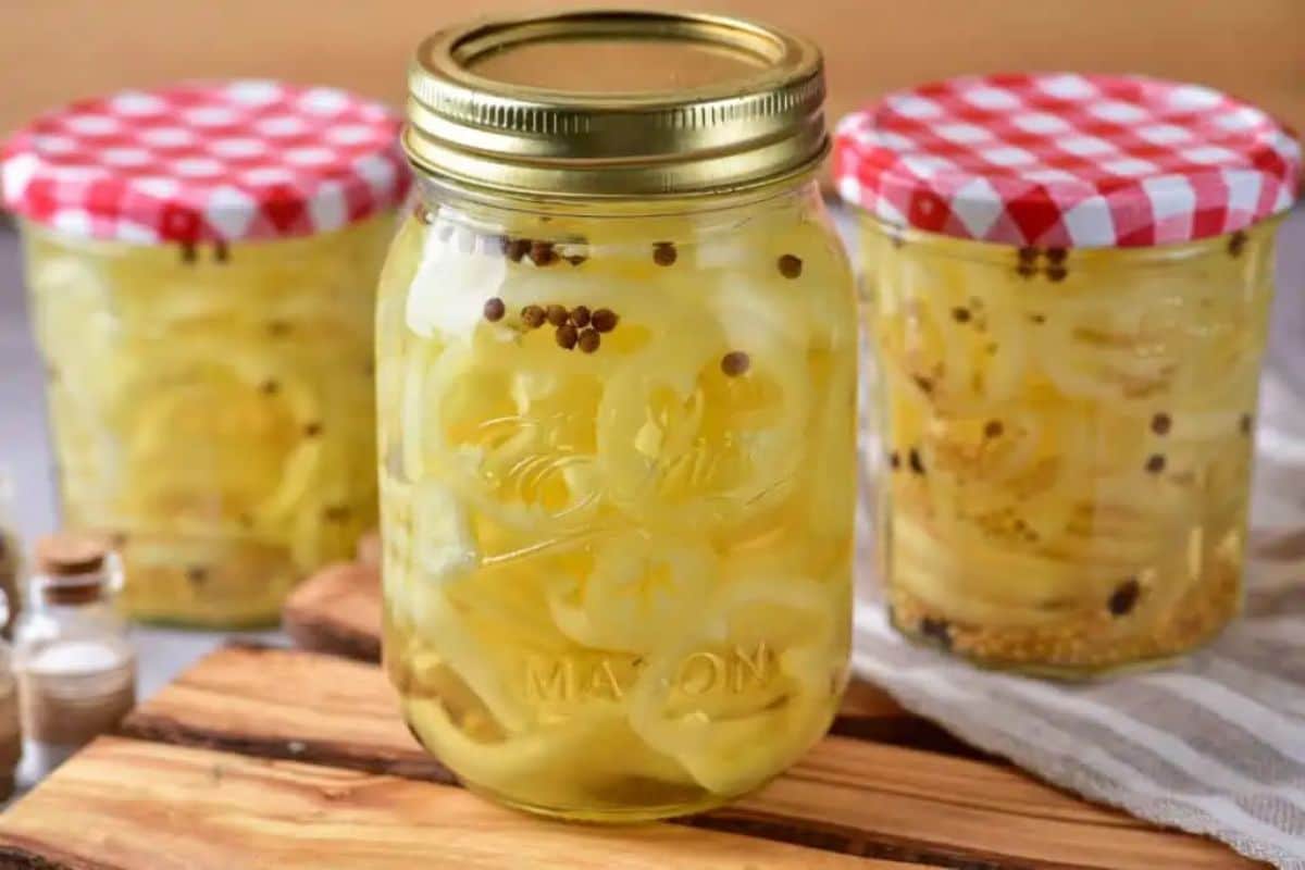 Pickled banana peppers in glass jars.