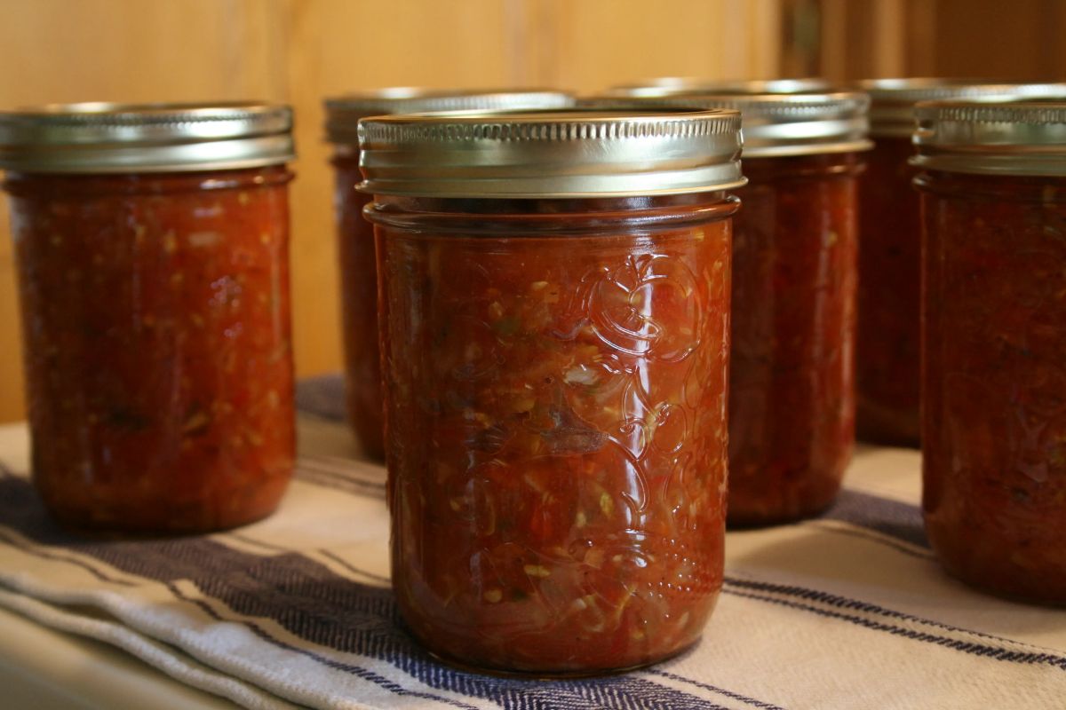 Zucchini salsa canned in glass jars.