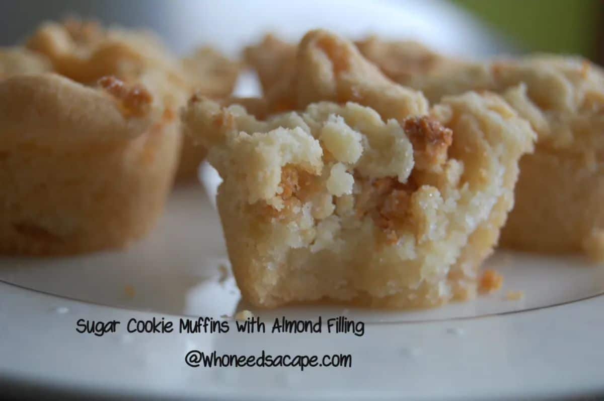 Sugar cookie muffins with almond filling on a tray.