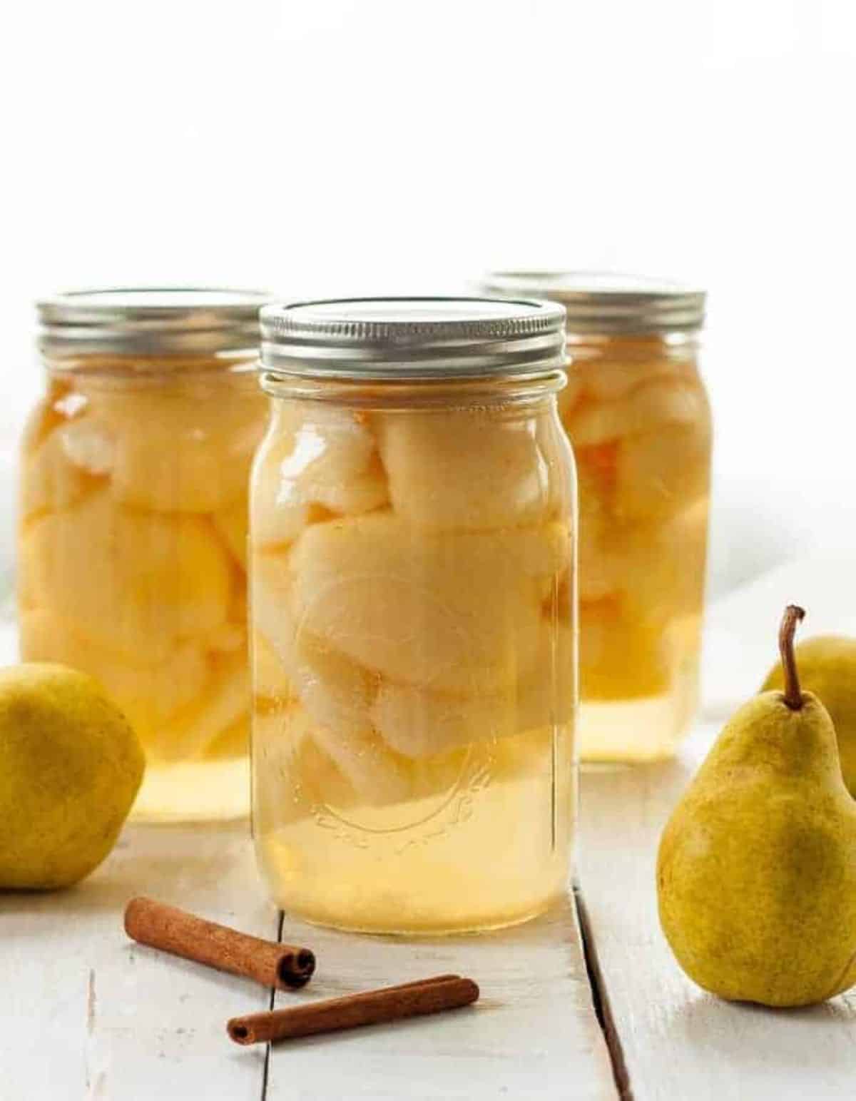 Delicious easy canned pears in glass jars.