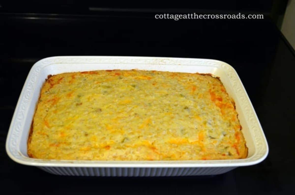 Corn pudding in a white casserole.