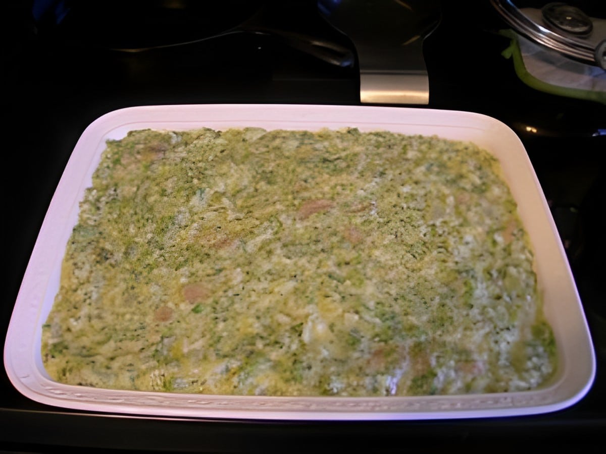 Broccoli rice in a white casserole.