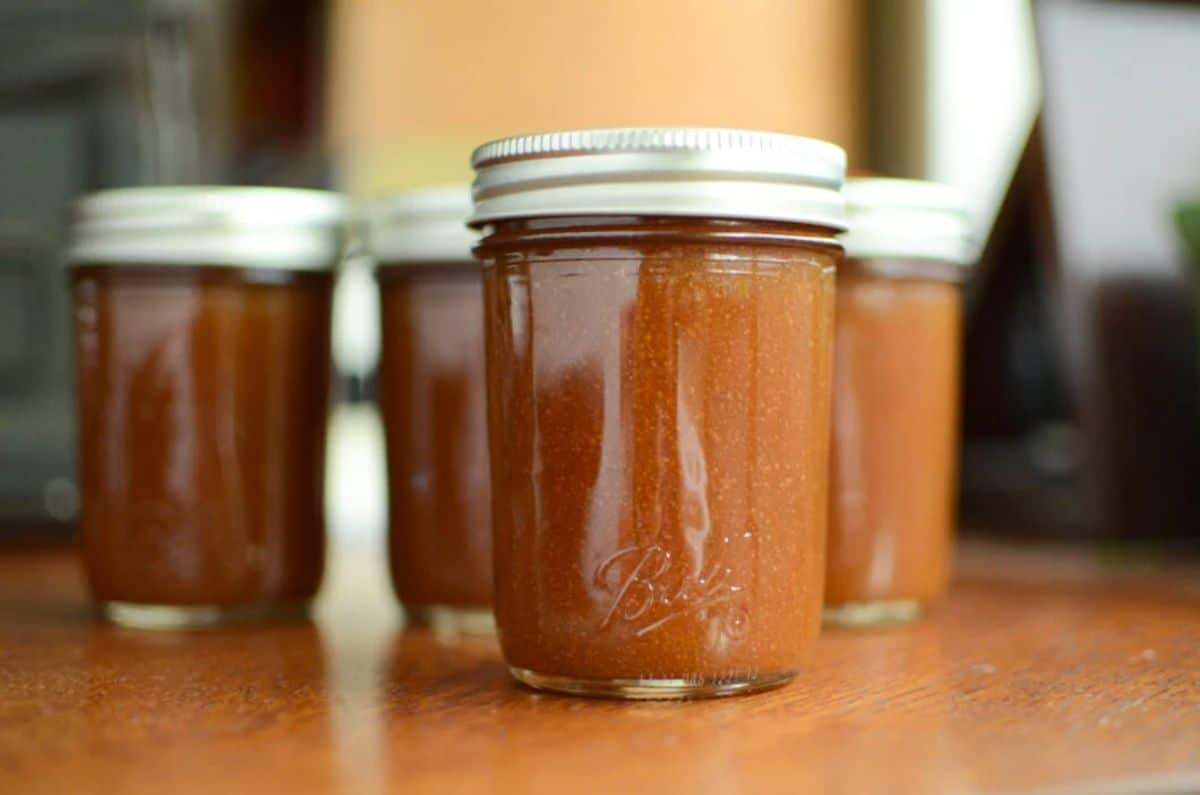 Salted caramel pear butter canned in glass jars.