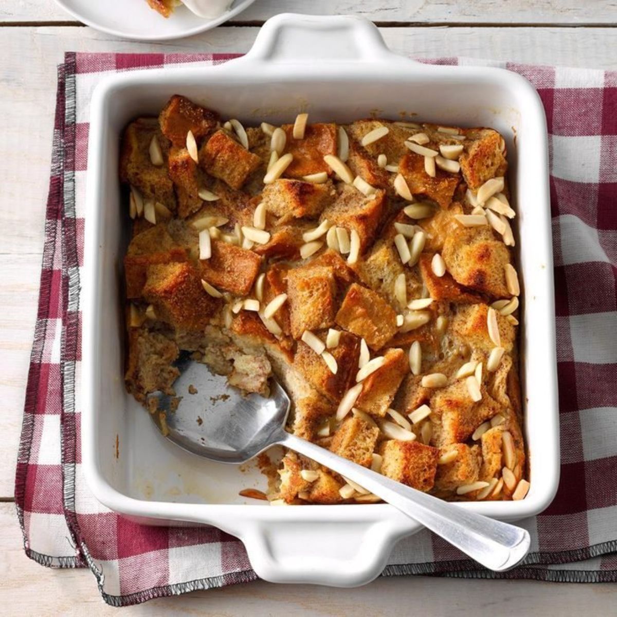 Tasty bread pudding in a white casserole.