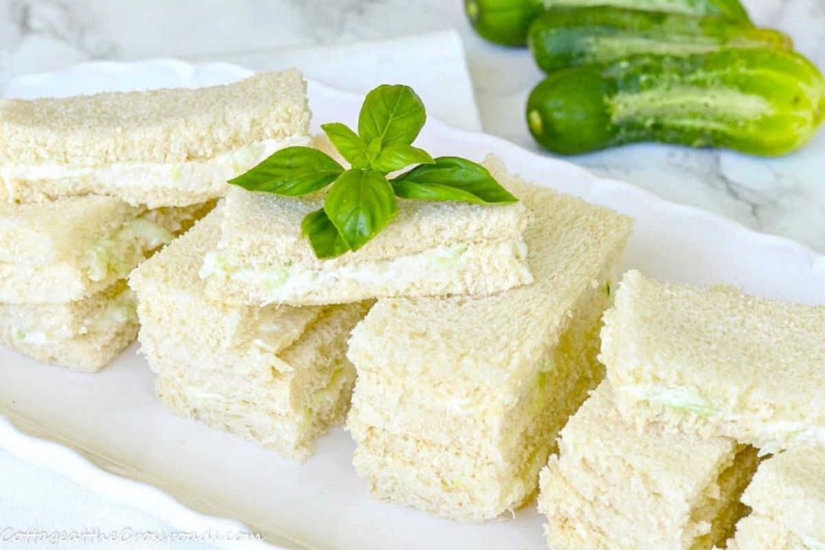 Crunchy cucumber sandwich spreads on a white tray.