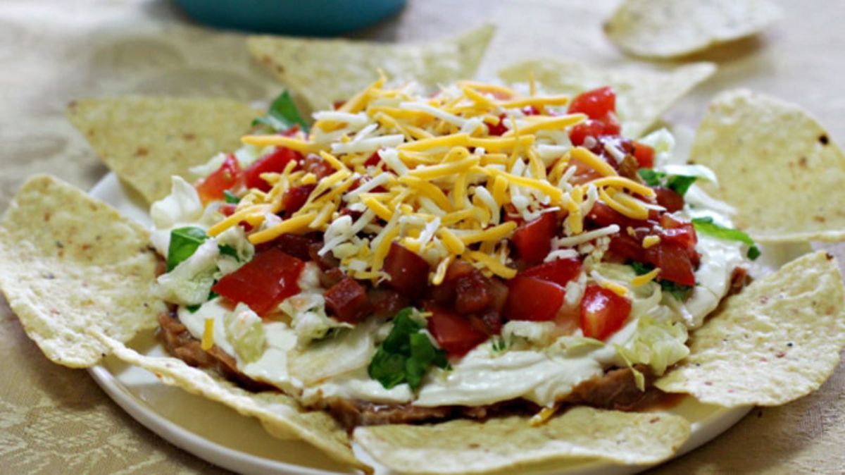 Delicious cielito lindo with chips on a white plate.