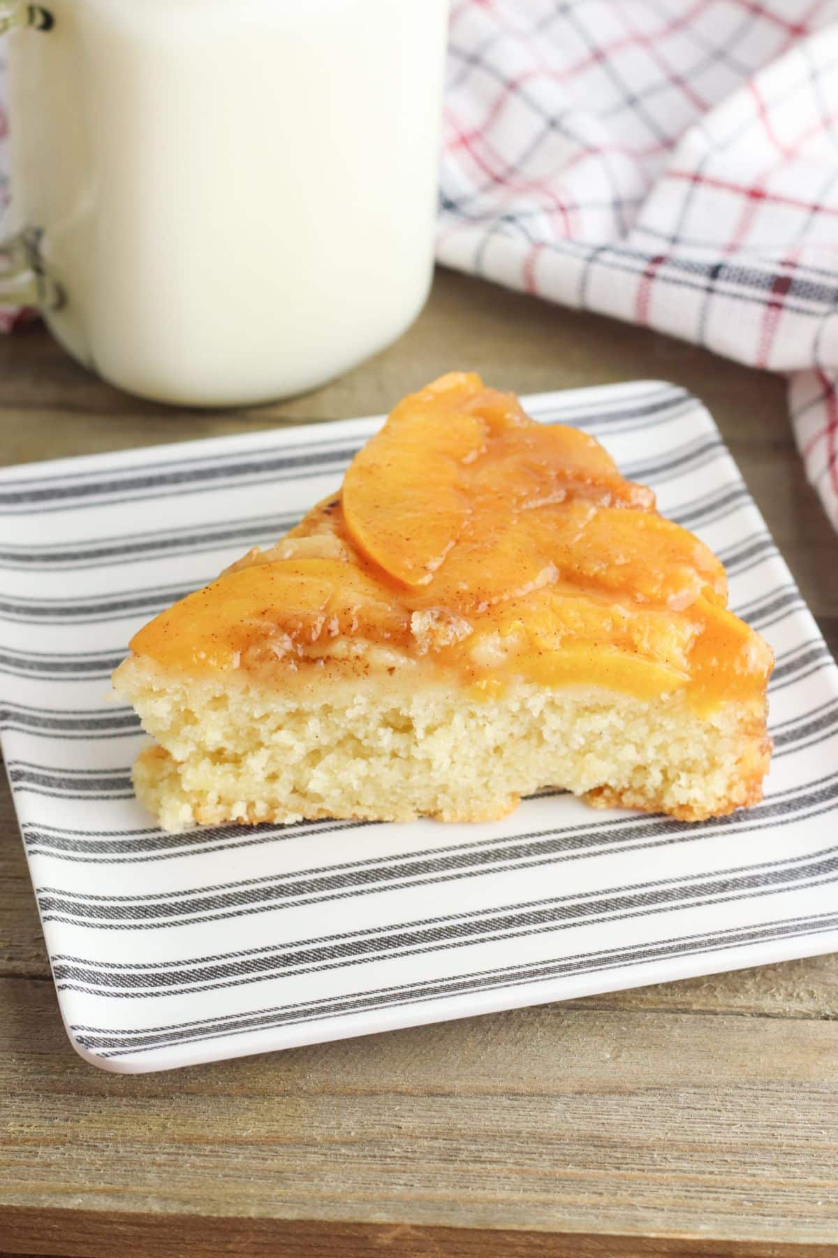 A piece of delicious upside down cake on a plate.