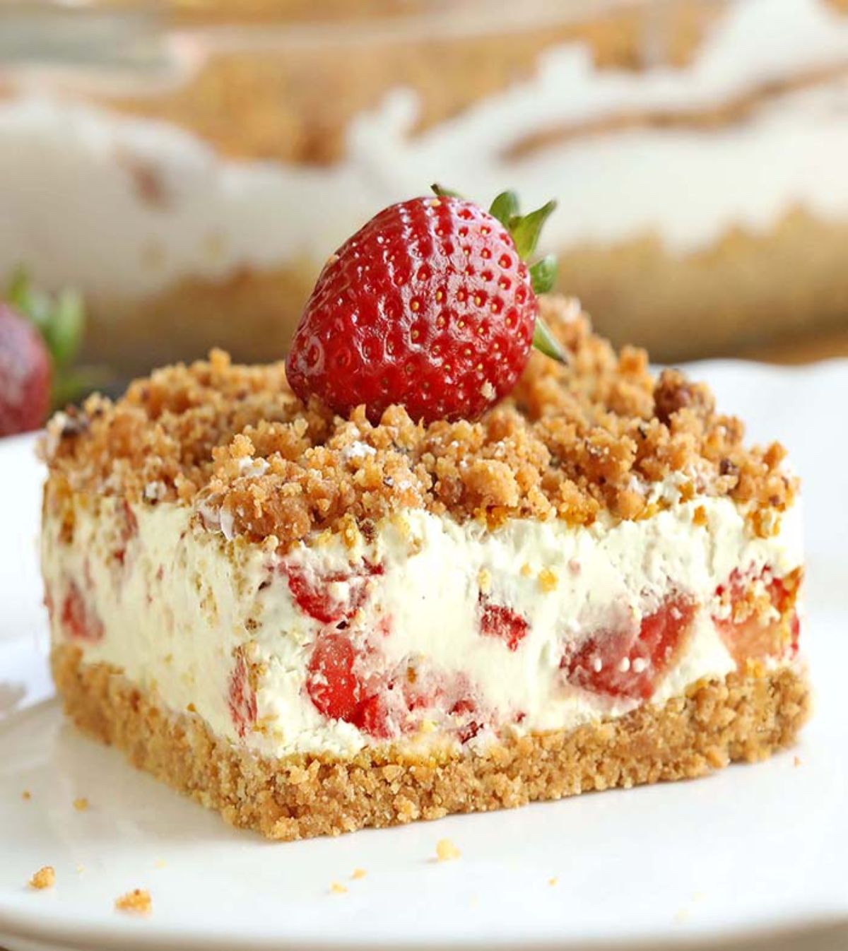 Scrumptious frozen strawberries and cream dessert on a white plate.