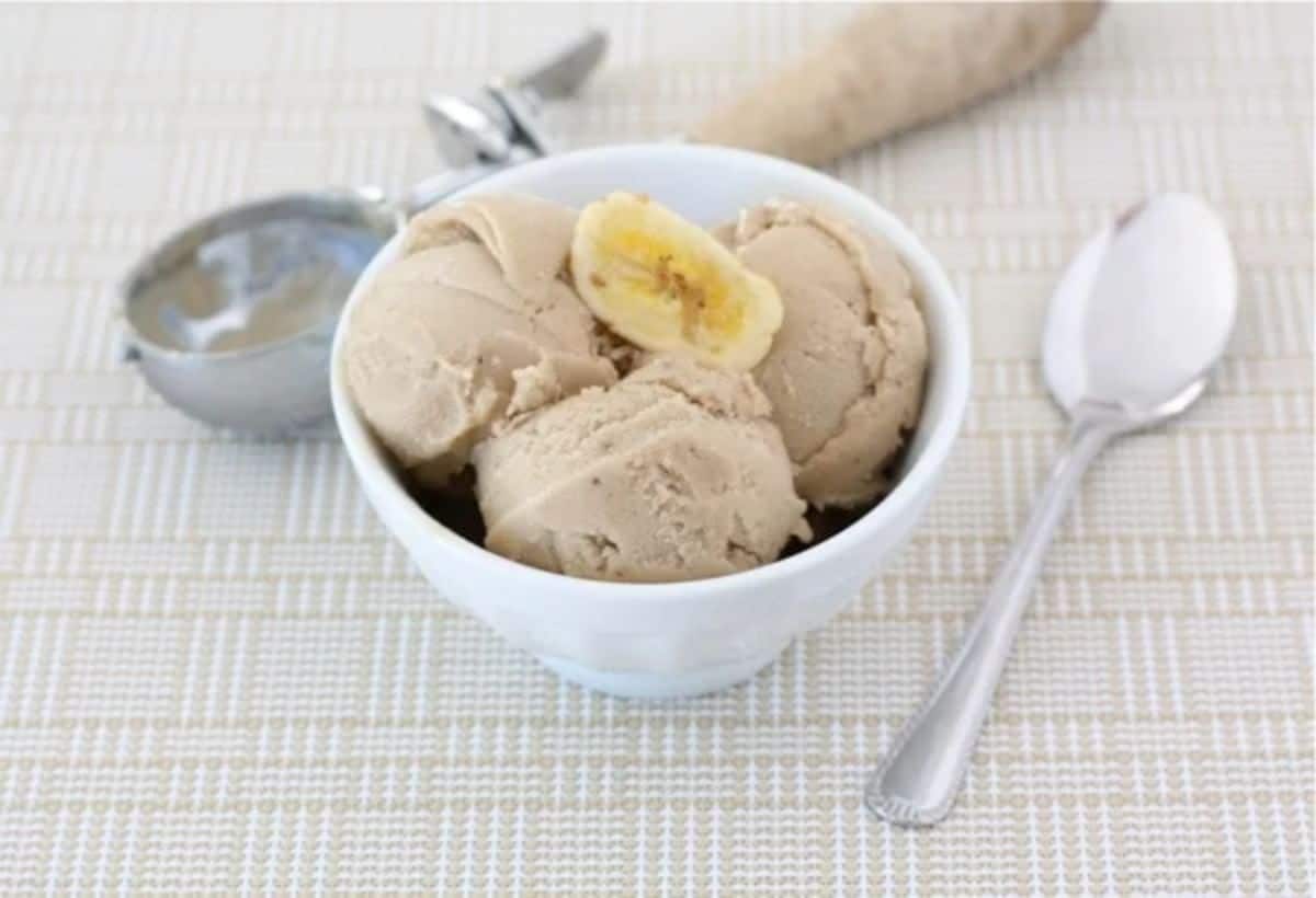 Sweet two-ingredient banana ice cream with peanut butter in a white bowl.
