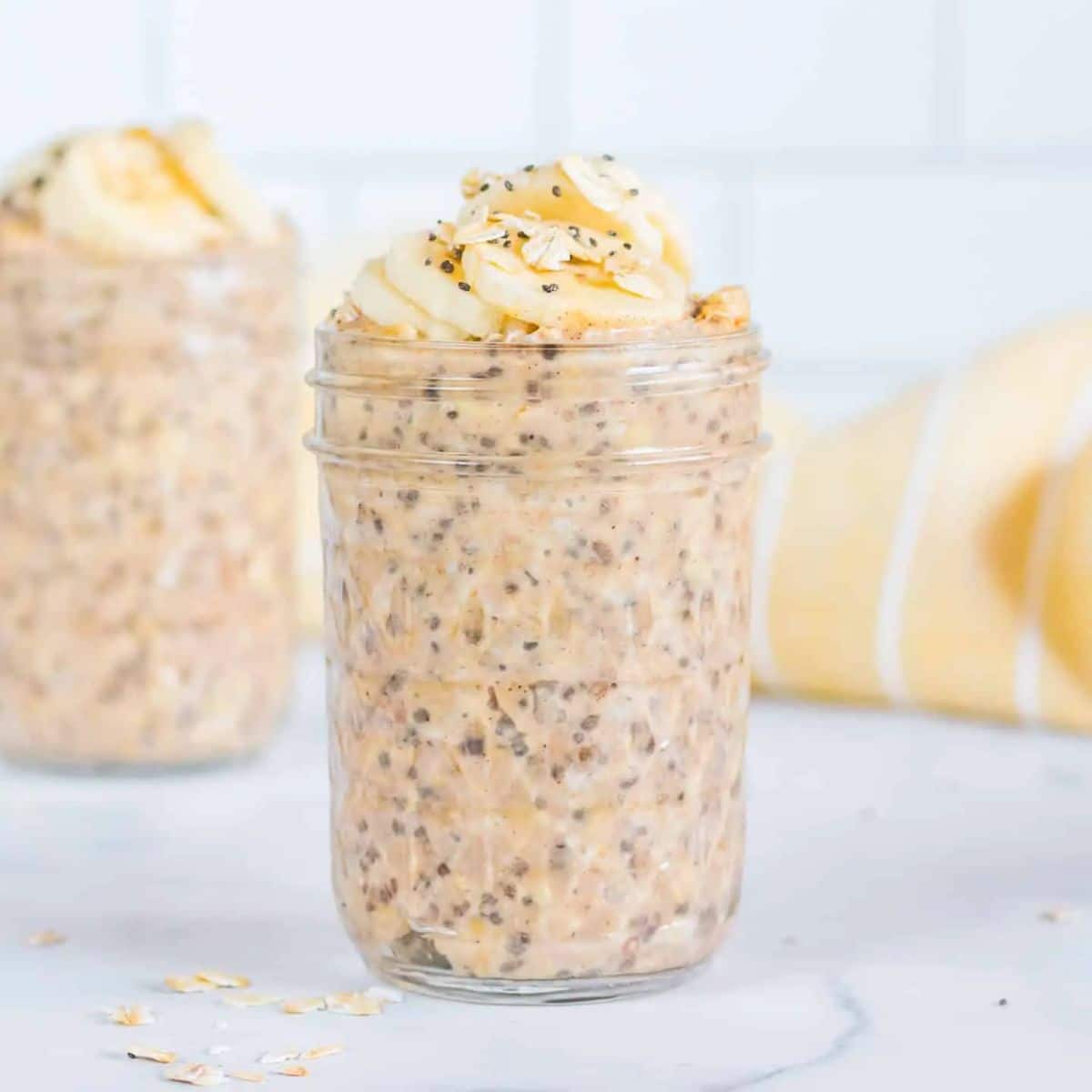 Delicious peanut butter overnight oats in a glass jar.