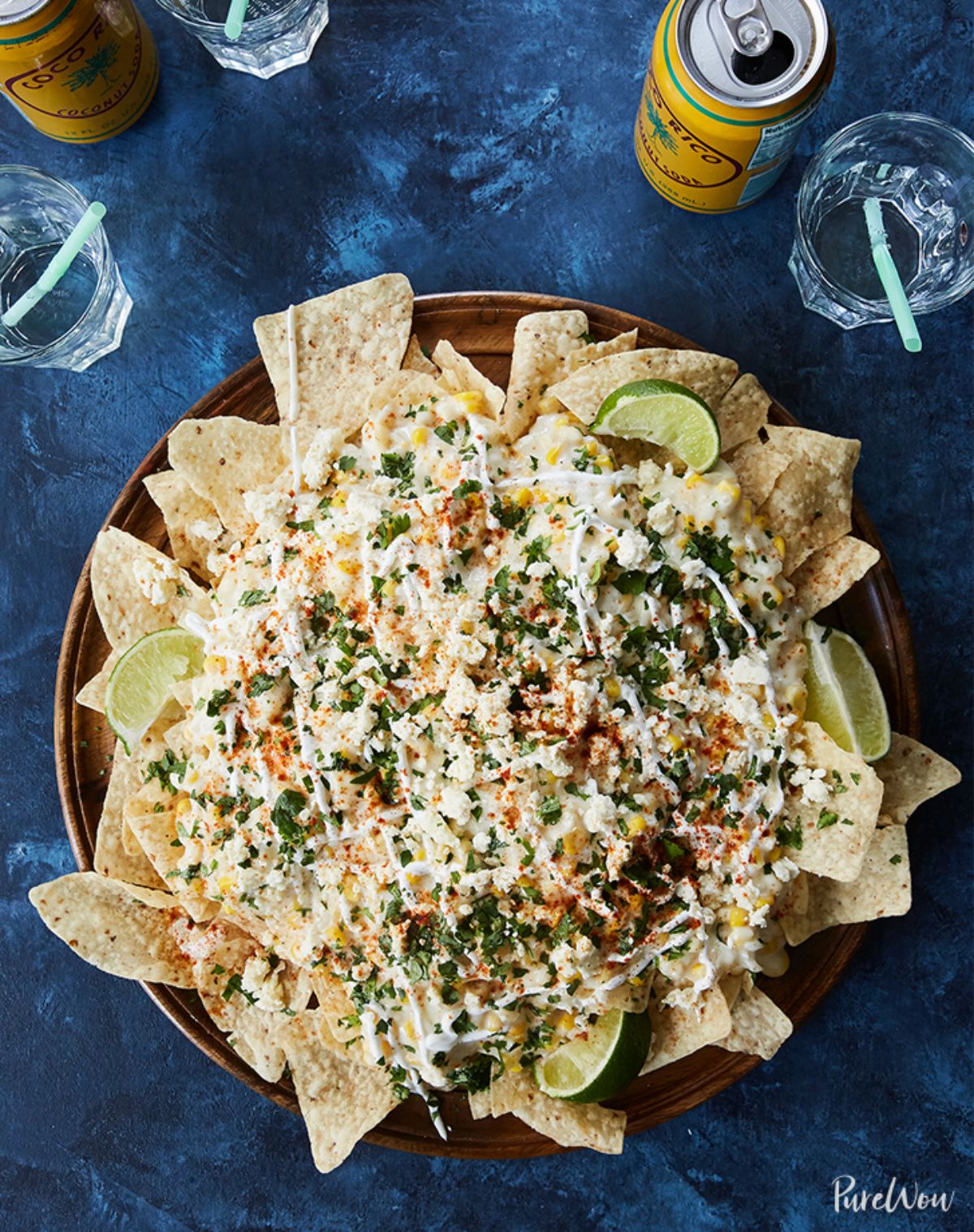 Flavorful mexican street corn dip with chips in a wooden bowl.