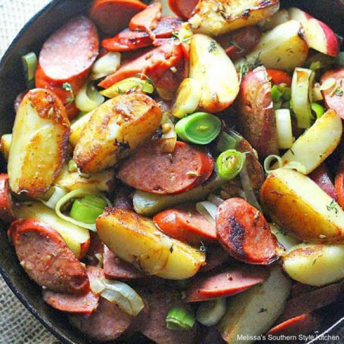 Delicious skillet cajun potatoes with andouille in a skillet.