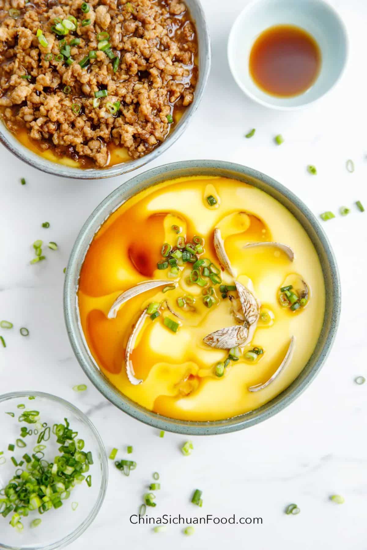 Mouth-watering steamed egg in a gray bowl.