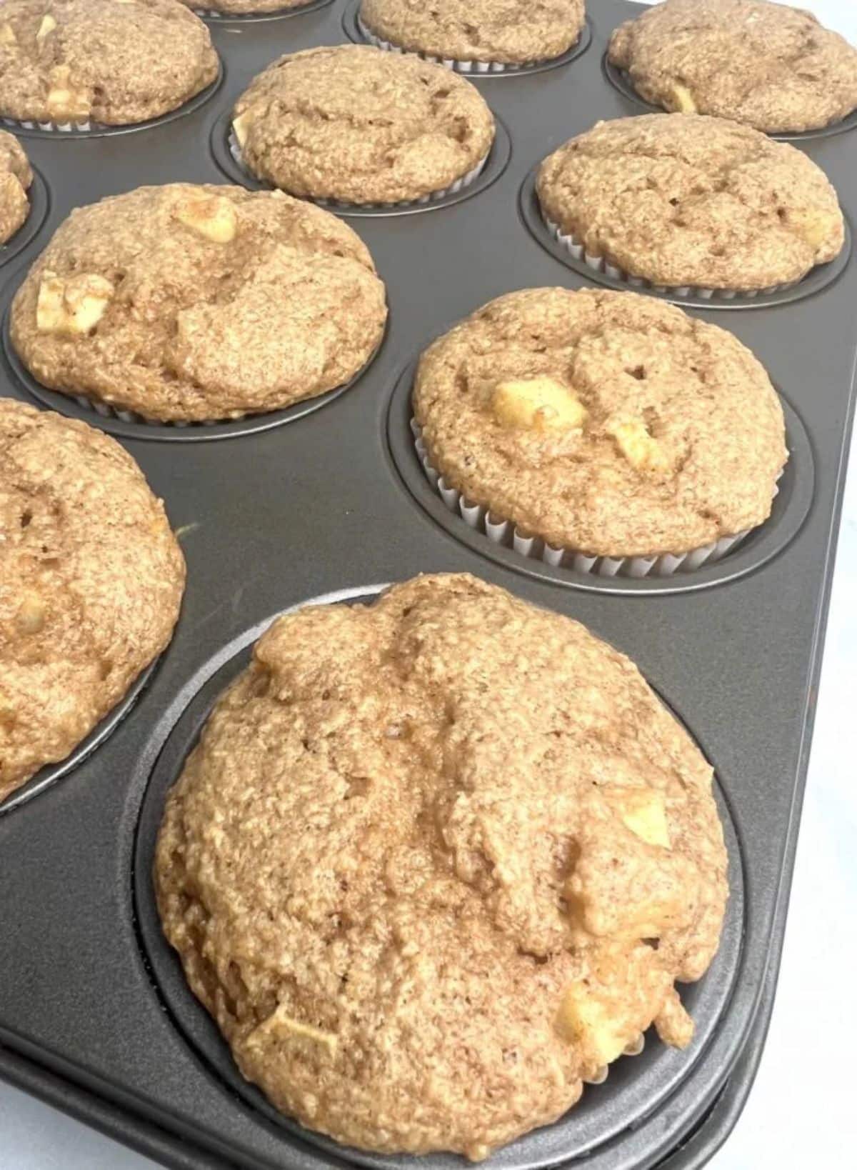 Tasty three-ingredient apple spice muffins in a muffin tray.