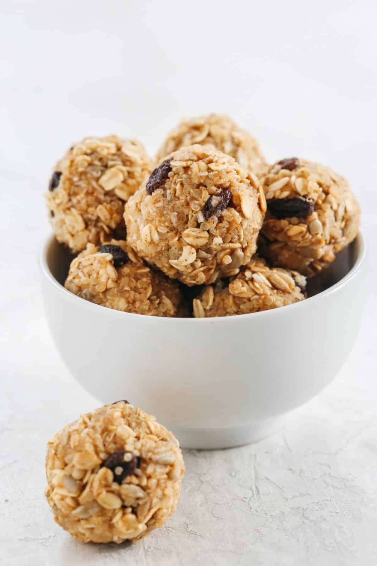 Scrumptious peanut butter energy balls in a white bowl.