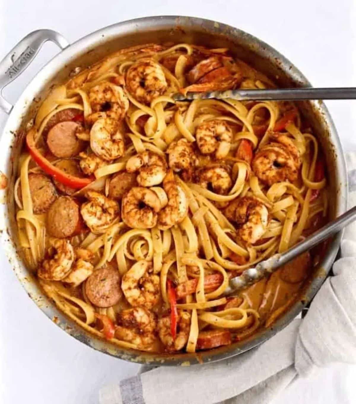 Tasteful creamy cajun shrimp pasta in a skillet.