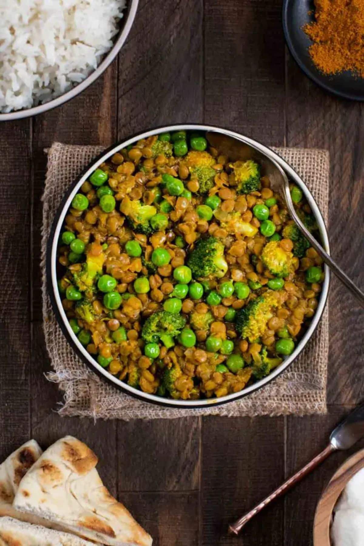 Flavorful one-pot curry with peas on a plate with a fork.
