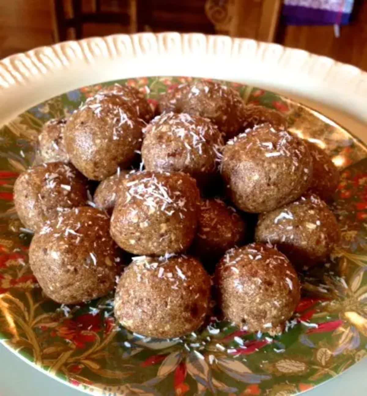Flavorful almond joy protein balls on a colorful plate.