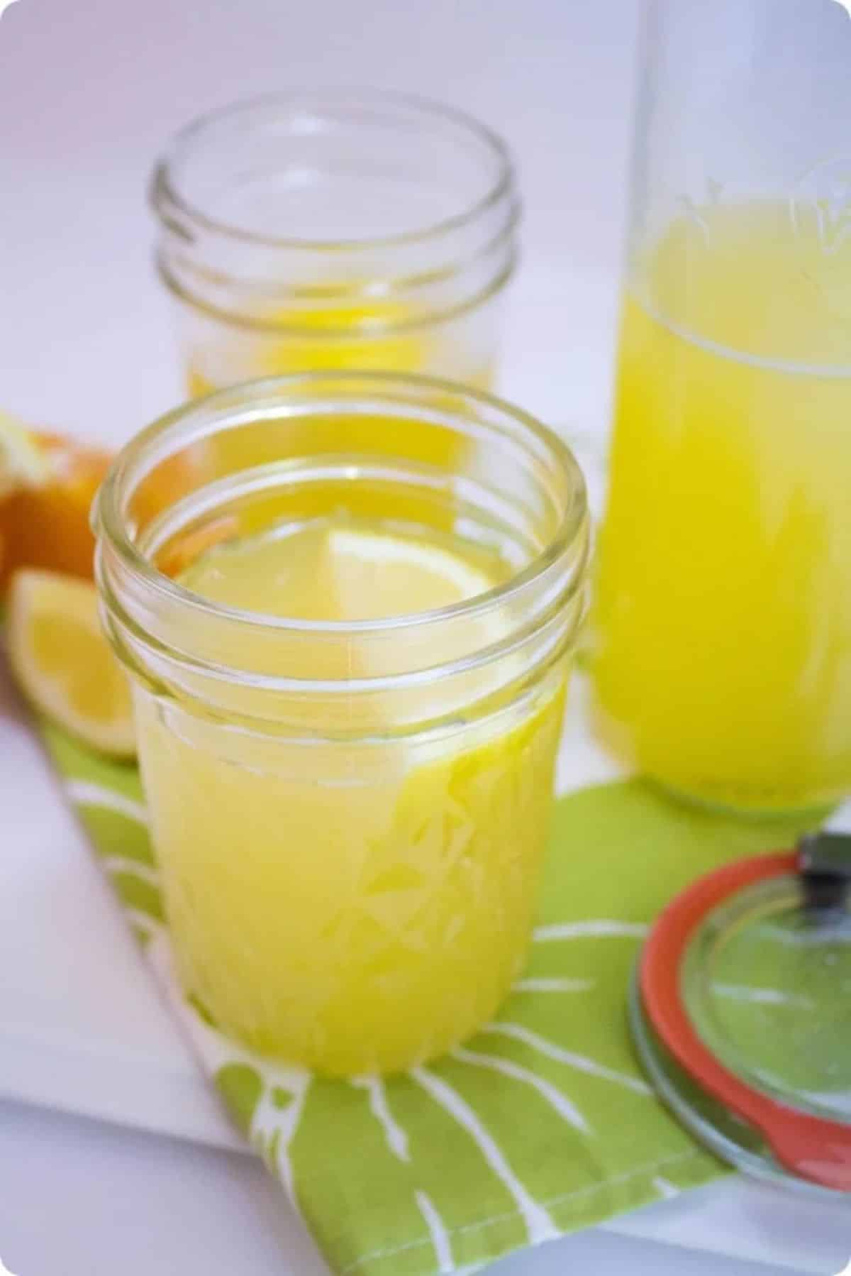 Refreshing homemade citrus sport drink in glass jars.