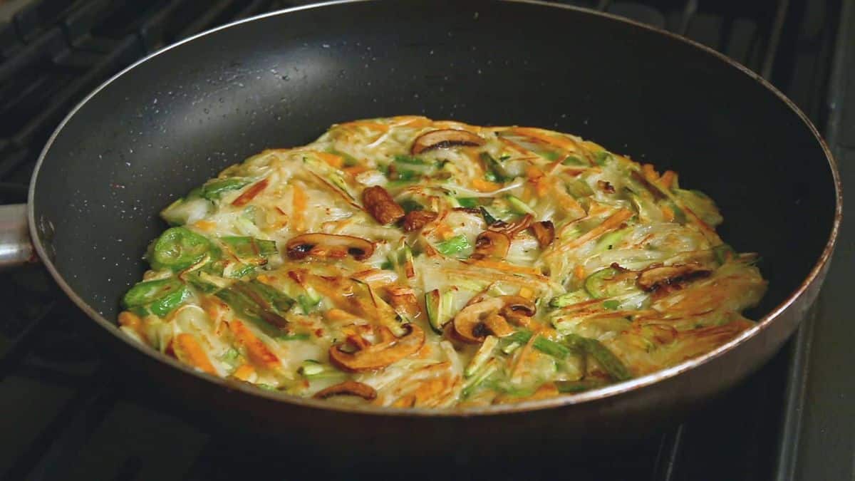 Healthy vegetable pancake in a skillet.