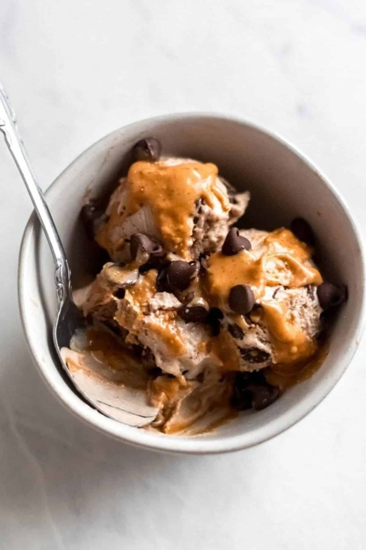 Fresh banana ice cream in a bowl with a spoon.
