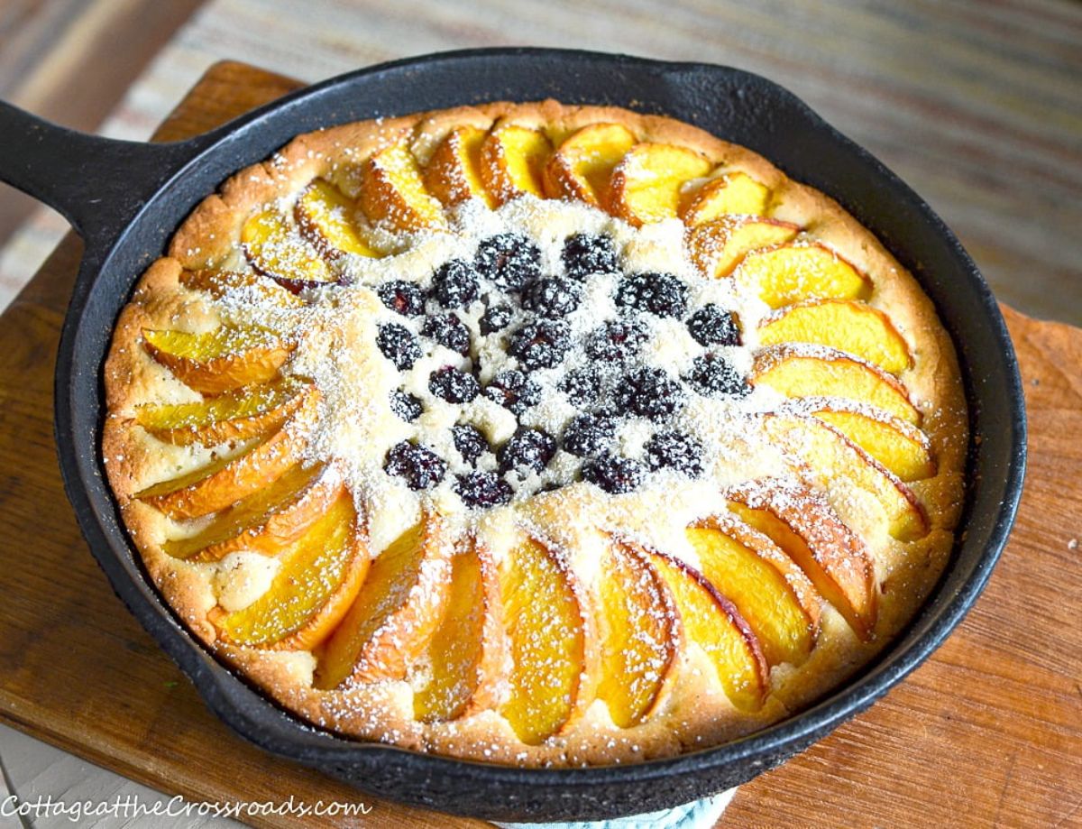 Delicious blackberry-peach buckle in a black skillet.