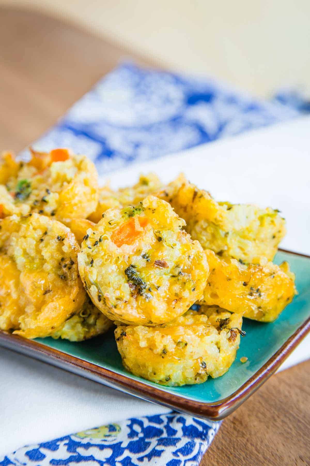 Scrumptious cheesy veggie quinoa bites on a tray.