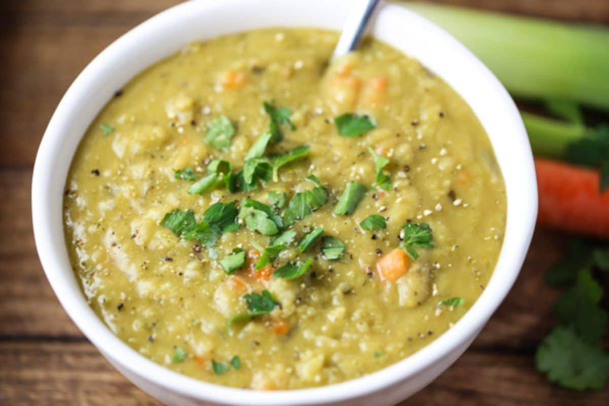 Creamy split pea soup in a white bowl.