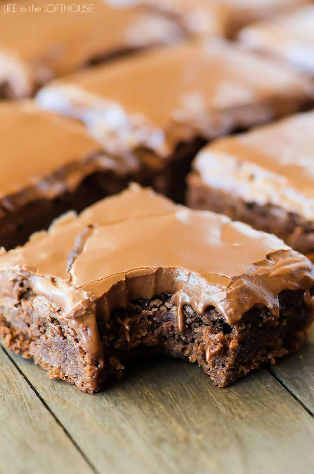 Scrumptious lunch lady brownies on a wooden table.