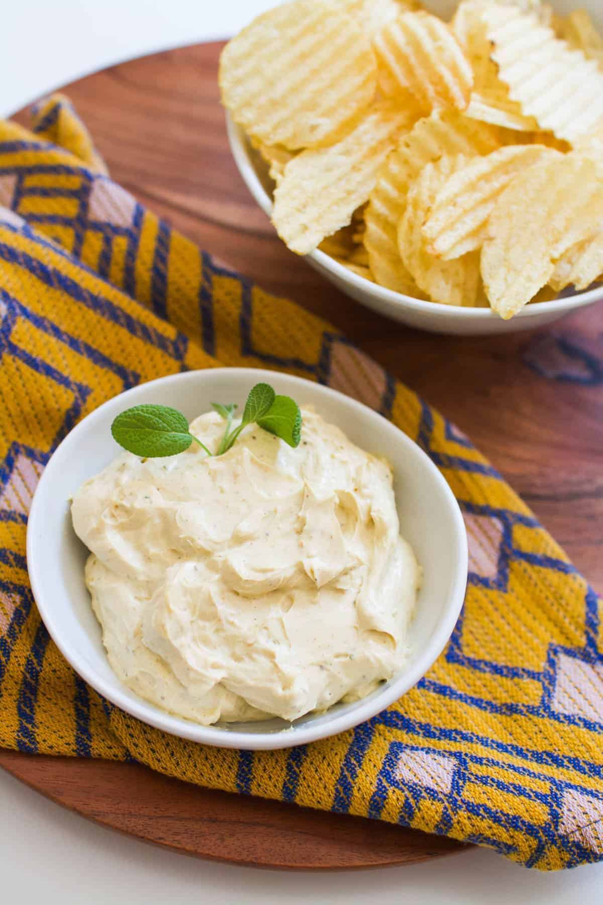 Creamy old bay chip dip in a white bowl.
