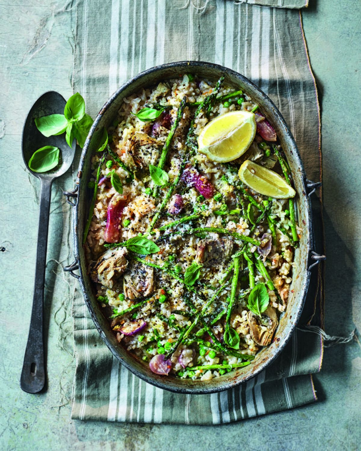 Delicious pea risotto in a gray bowl.