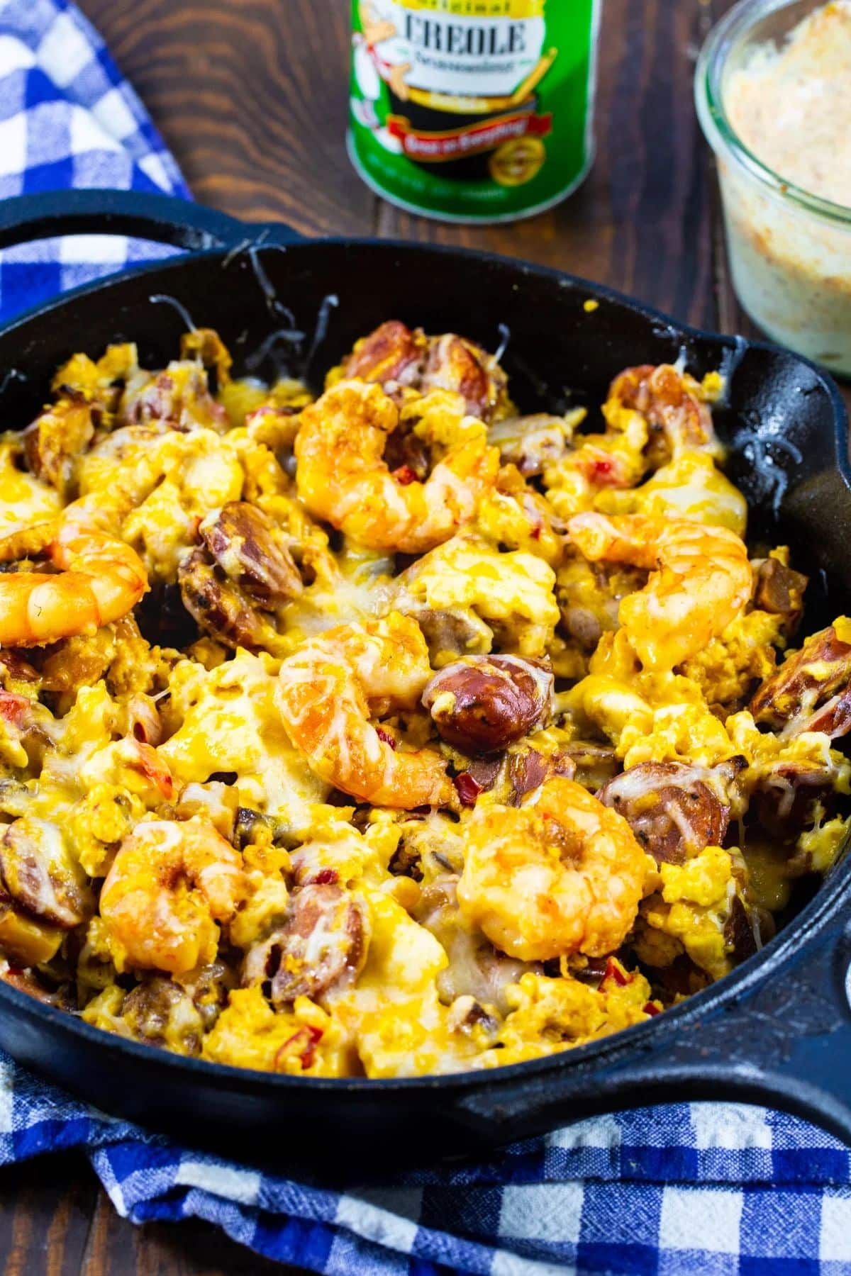 Scrumptious cheesy creole breakfast in a black skillet.