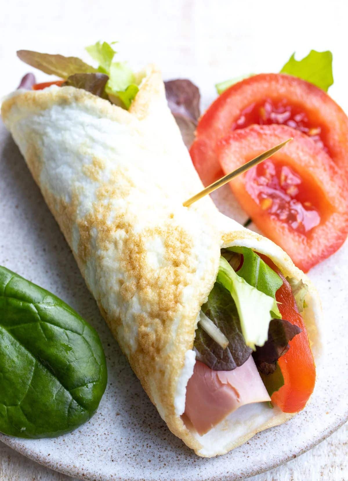 Delicious egg white wrap on a plate.