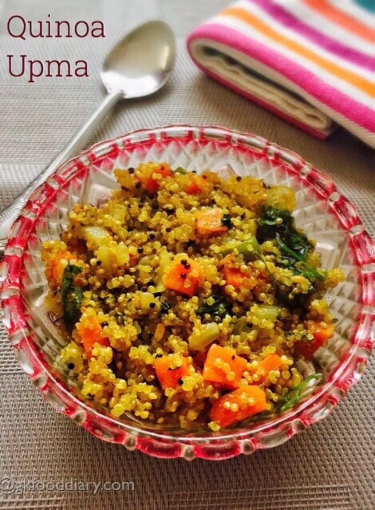 Healthy quinoa upma in a glass bowl.