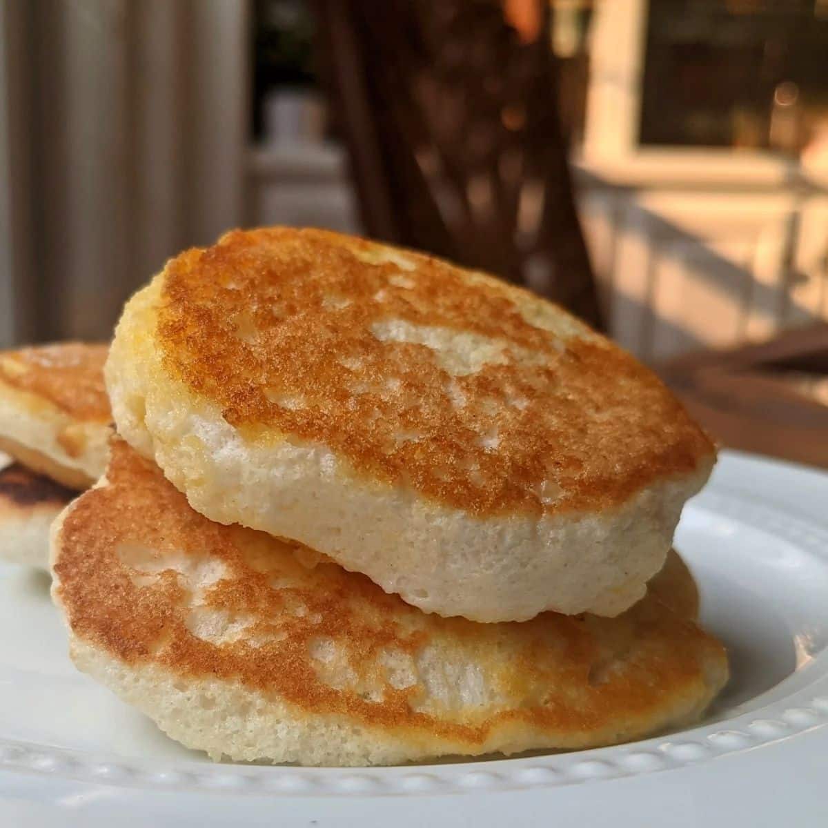 Scrumptious egg white souffle pancakes on a white plate.