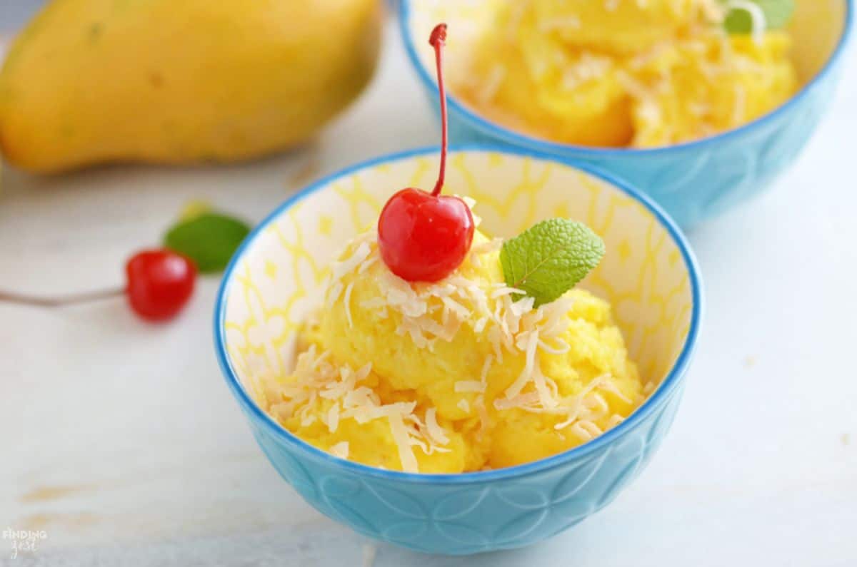 Delicious mango and pineapple sorbet in a blue bowl.