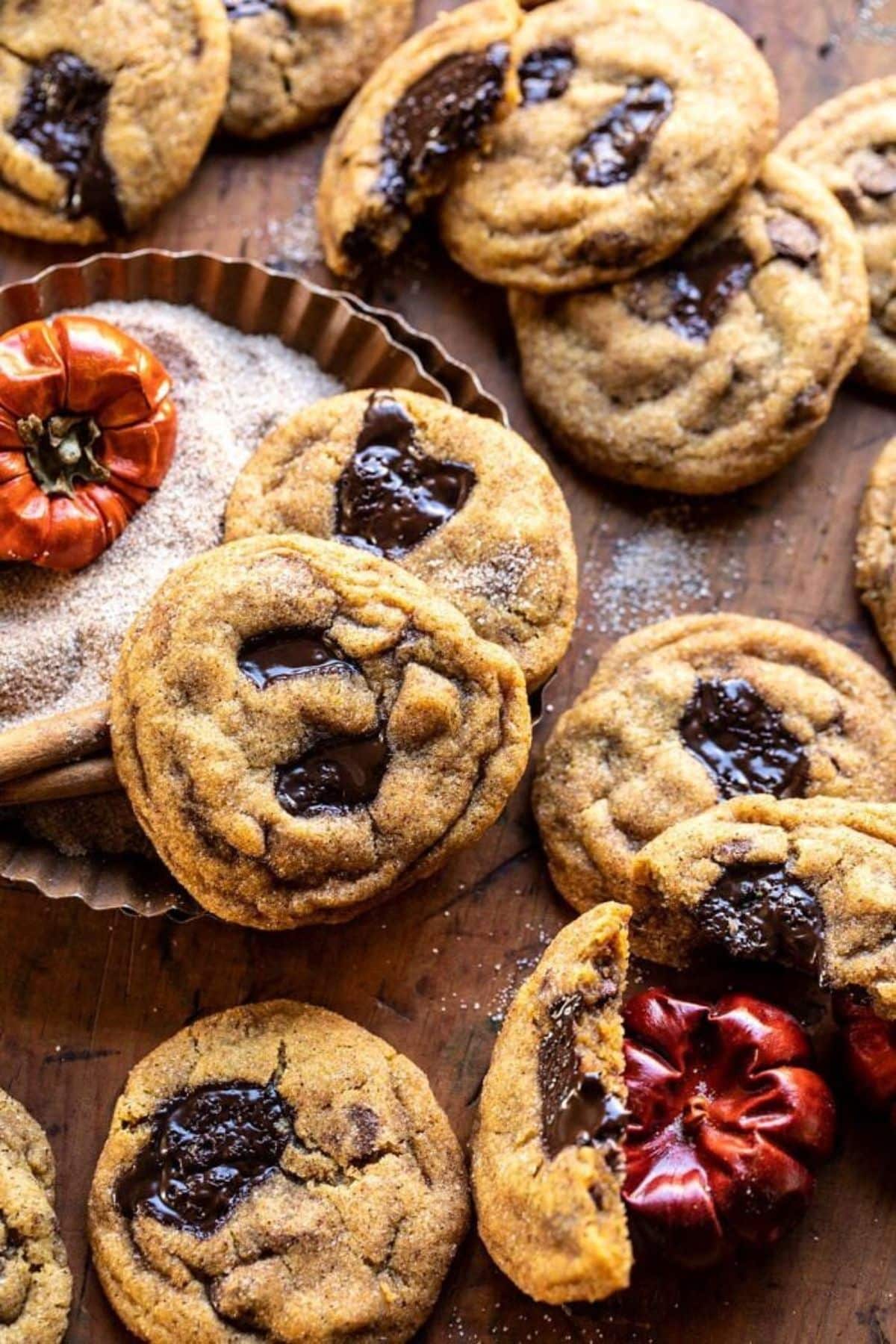 Delicious pumpkin butter chocolate chip cookies on a wooden table.