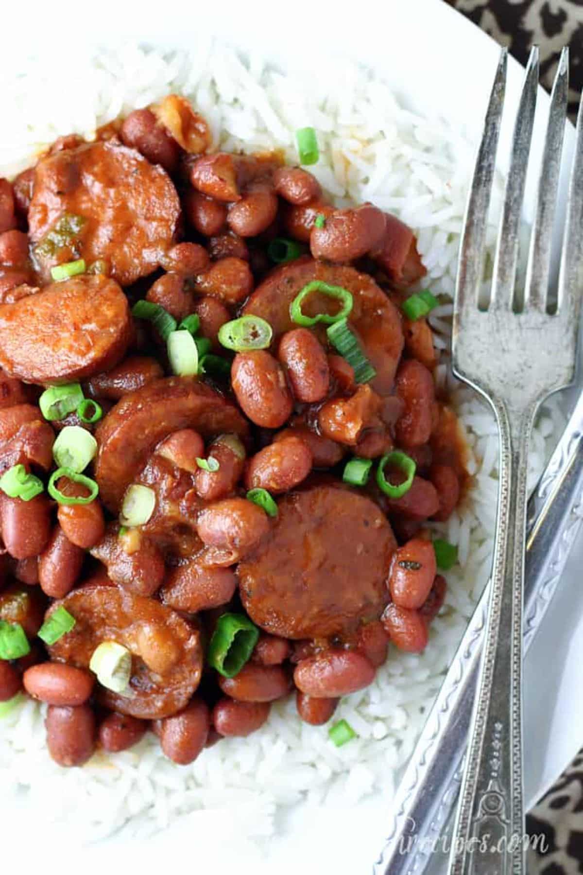 Healthy red beans and rice on a plate with a fork.