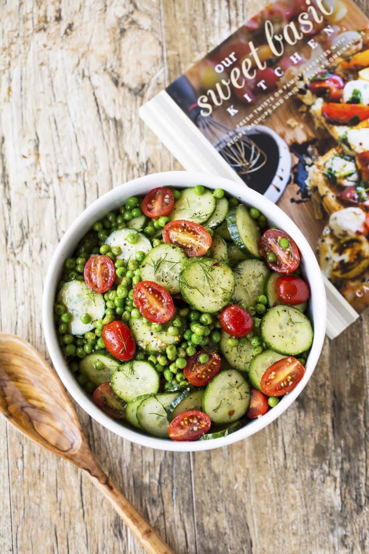 Healthy pea and cucumber salad in a white bowl.