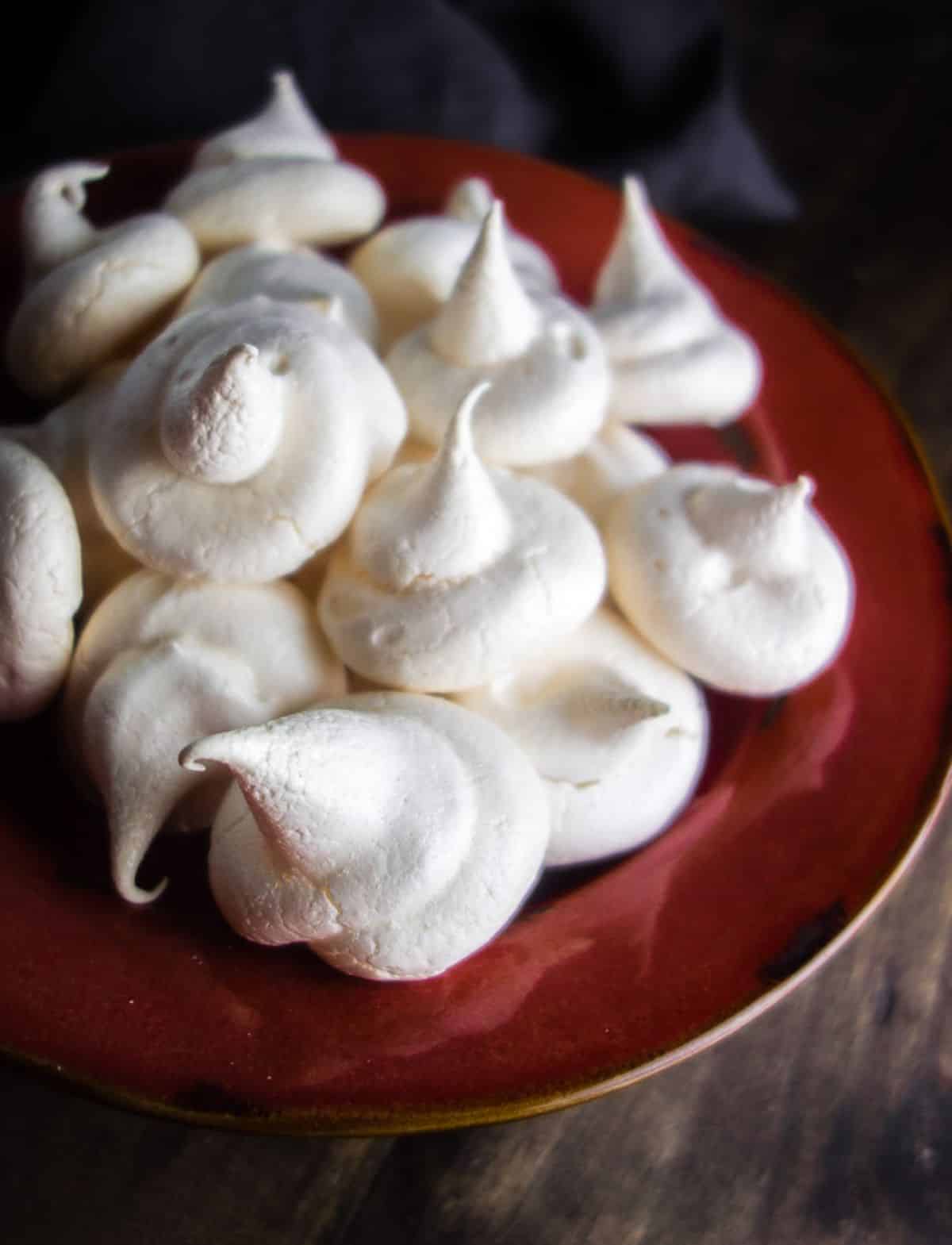 Crunchy almond meringues on a cake tray.