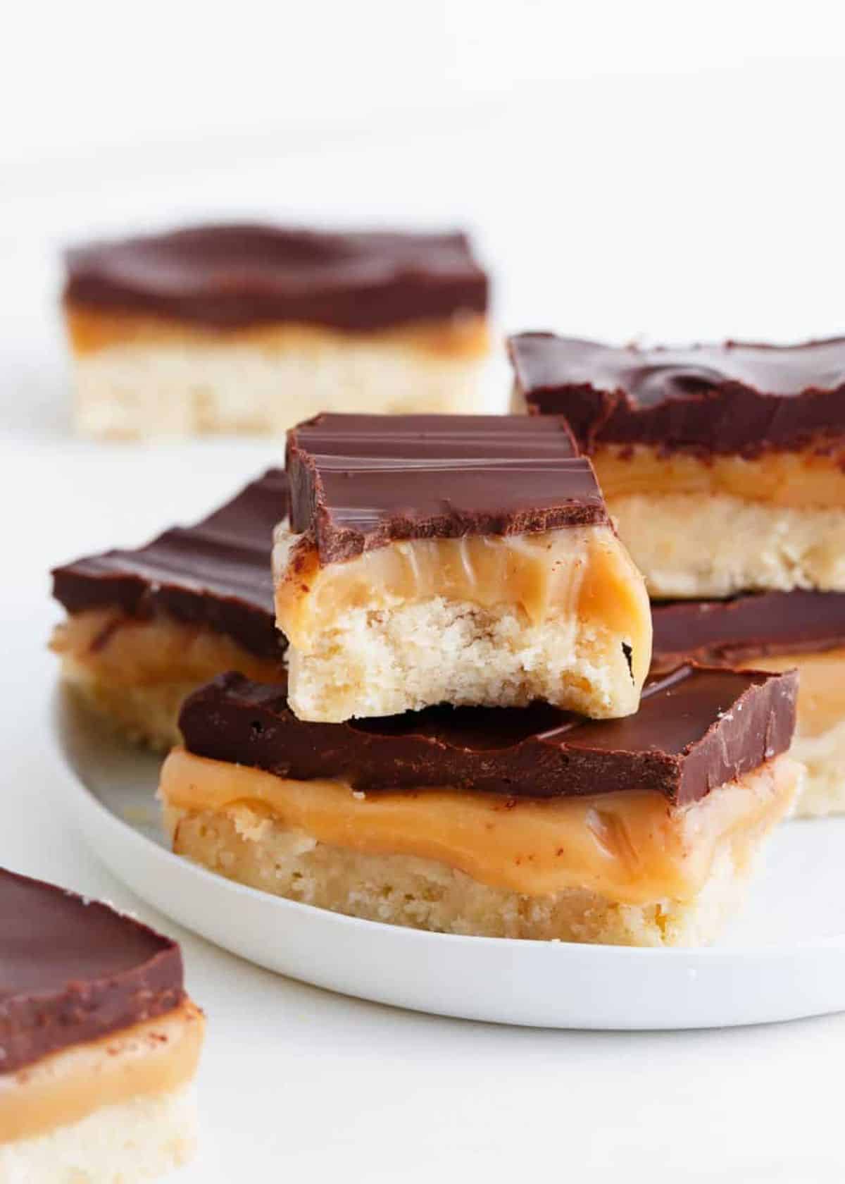 Scrumptious homemade twix cookie bars on a tray.
