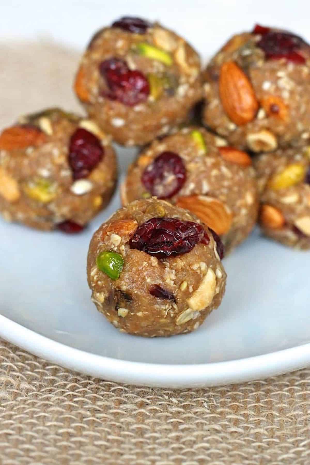 Delicious trail mix quinoa energy bites on a plate.