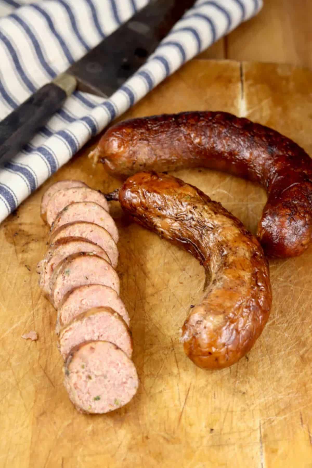 Scrumptious andouille sausage on a wooden cutting board.