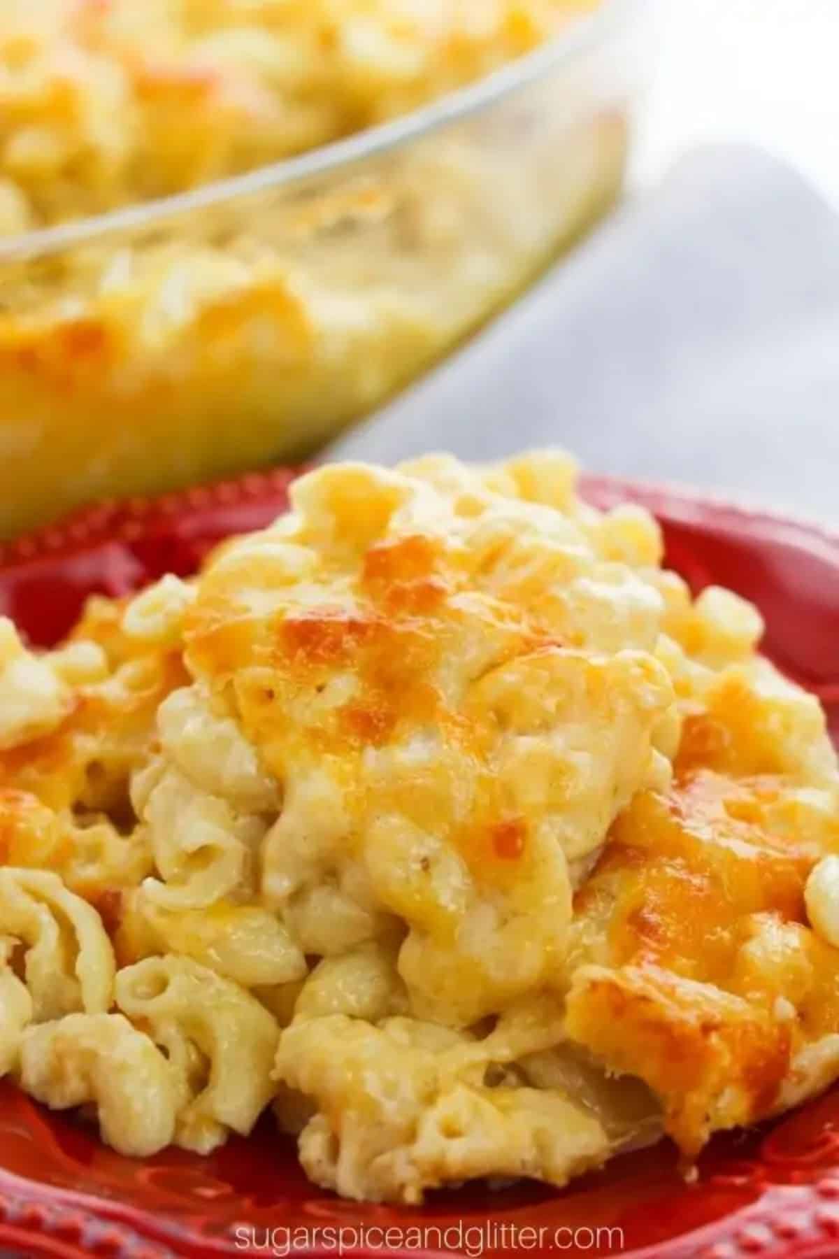 Delicious southern baked mac and cheese on a red plate.