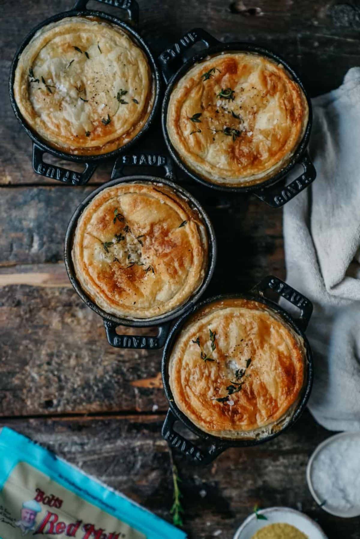 Scrumptious mushroom pot pies on a wooden table.
