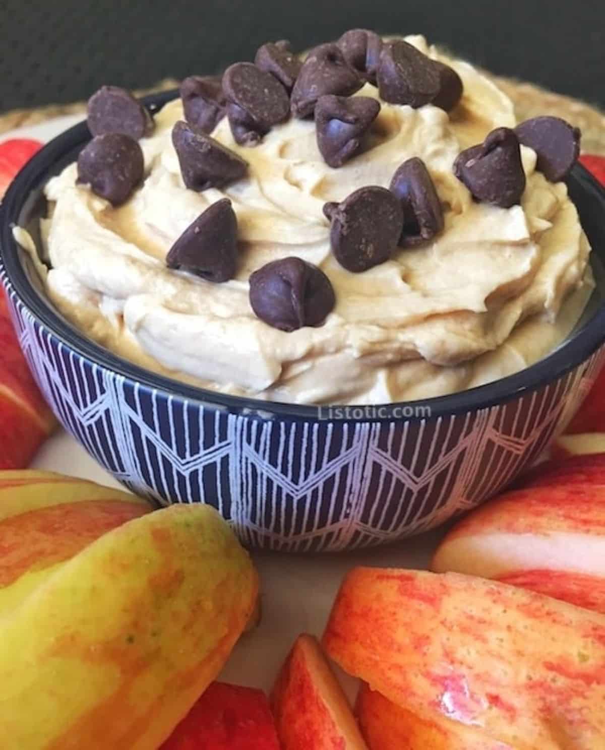 Delicious 3-ingredient healthy peanut butter dip in a blue bowl.