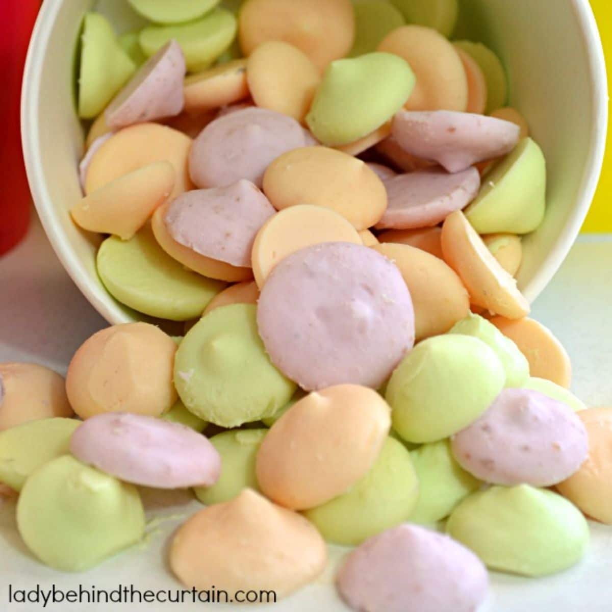 Spilled frozen yogurt buttons from a bowl.