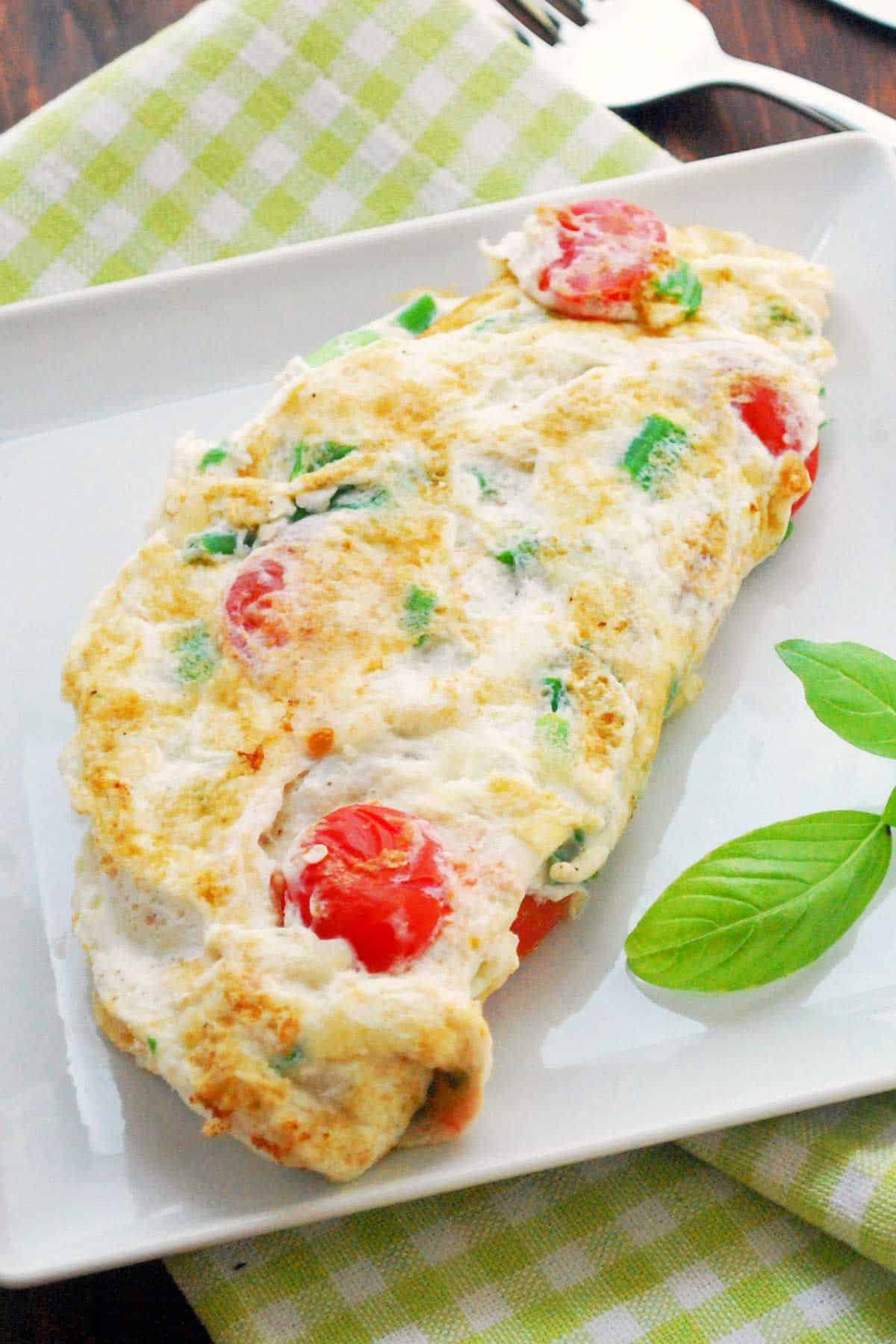 Healthy egg white omelet on a white plate.