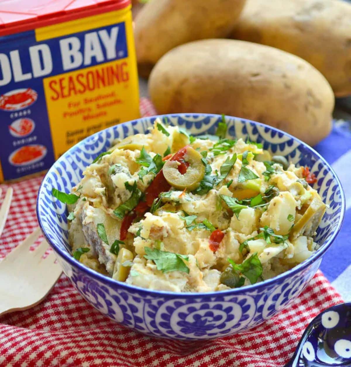 Healthy old bay potato salad in a blue bowl.
